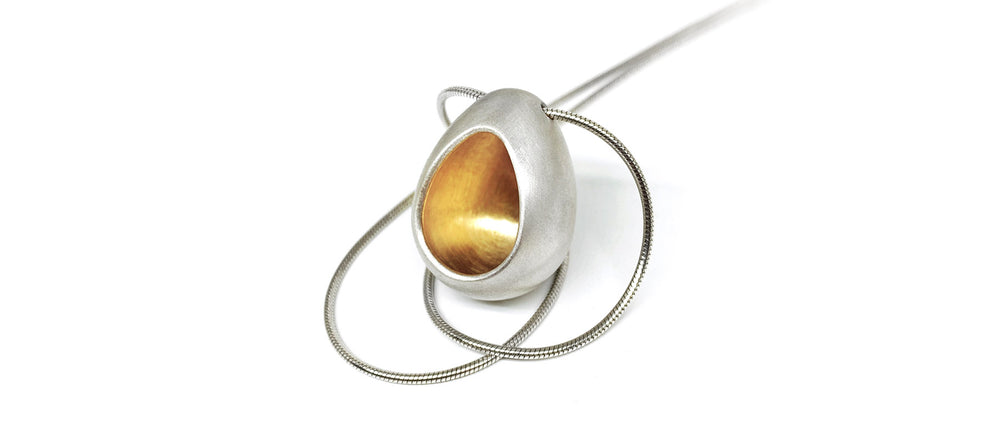 silver and gold egg pendant - ovo