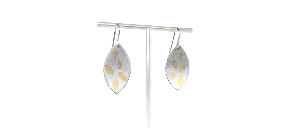 silver leaf shaped earrings with gold inlay leaf pattern